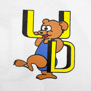 
                  
                    DEN SOUVENIR x UNFOUND PROJECT bear tee
                  
                