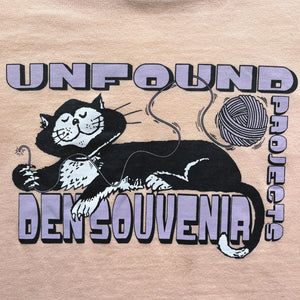 
                  
                    DEN SOUVENIR x UNFOUND PROJECT cat baby tee
                  
                