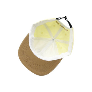 
                  
                    Den Golden triangle cap, yellow brown
                  
                